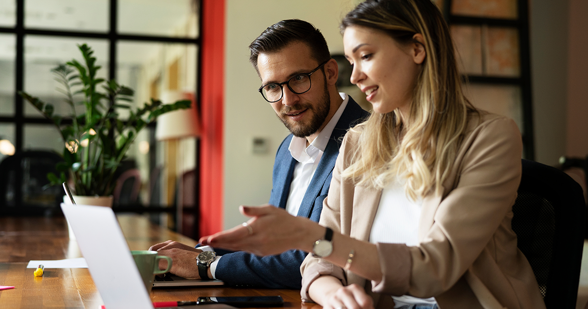Two people discussing in the office