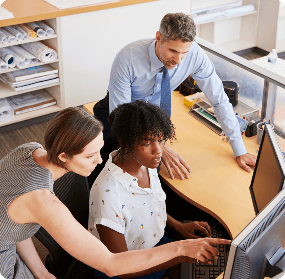 woman at computer with colleagues